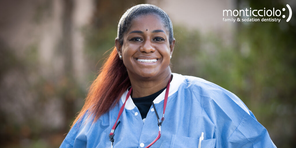 Smiling female dentist in scrubs. Smiling female dentist in scrubs.