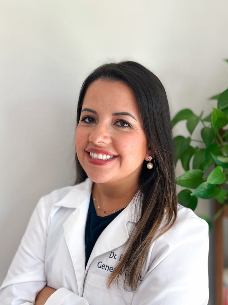 Smiling woman in white medical coat. Smiling woman in white medical coat.